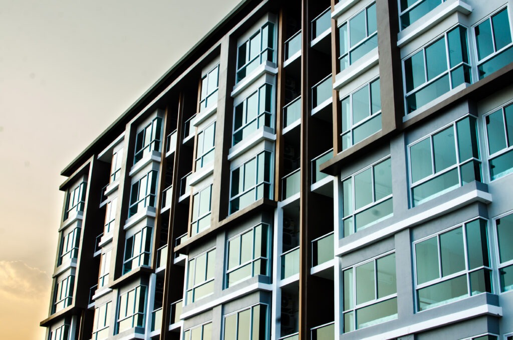 Modern residential building showcasing a facade of large windows and balconies